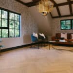 Oak herringbone floor in sun-filled home. Natural light coloured wood floor.