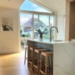 light natural wood flooring in open plan kitchen