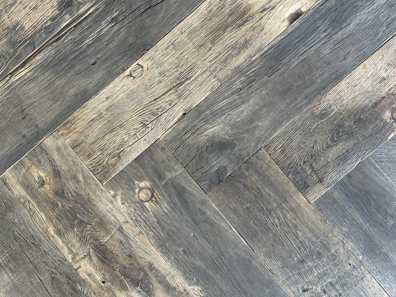 Reclaimed wood herringbone silver grey colour close up